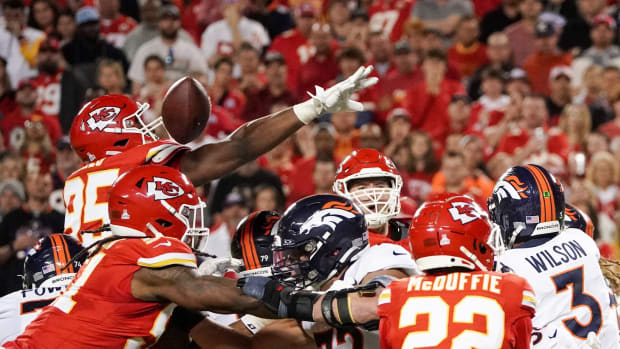 Kansas City Chiefs defensive tackle Chris Jones (95) deflects a pass from Denver Broncos quarterback Russell Wilson (3) during the second half at GEHA Field at Arrowhead Stadium.